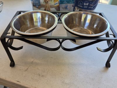 Dog bowl stand and disposable urine wraps and pads