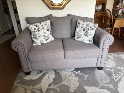 Gray fabric love seat
